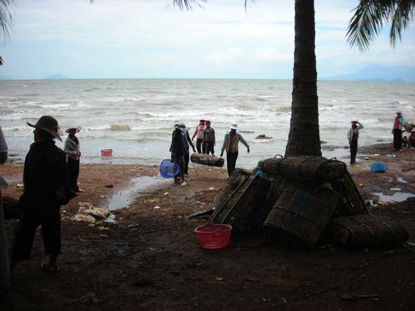 bringing back the catch of the day from the ocean in kep cambodia